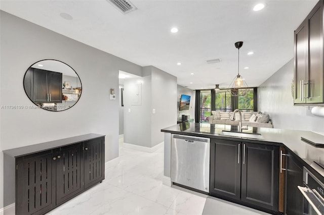 kitchen with a peninsula, a sink, stainless steel appliances, visible vents, and recessed lighting