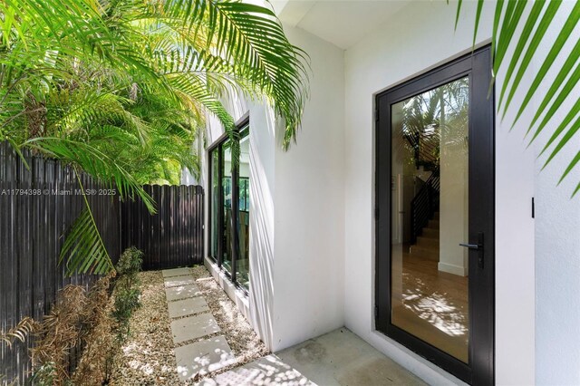 3132 Plaza St, Miami, FL 33133 - property entrance with fence and stucco siding