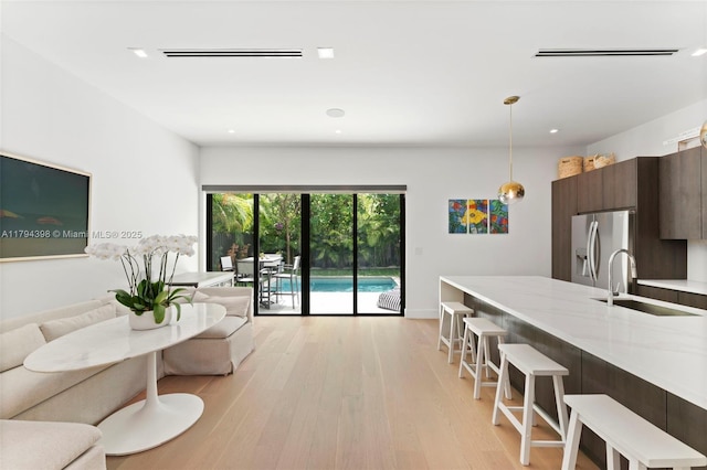 3132 Plaza St, Miami, FL 33133 - living area with light wood finished floors and recessed lighting