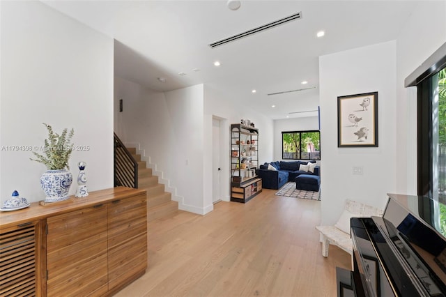 3132 Plaza St, Miami, FL 33133 - entryway with light wood-type flooring, stairs, recessed lighting, and baseboards