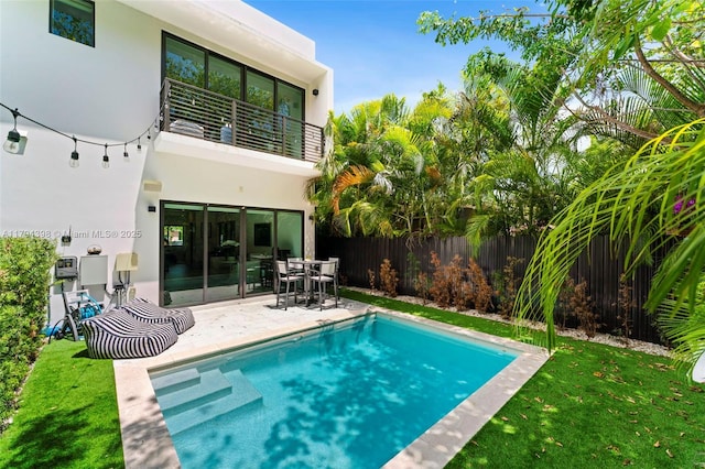 3132 Plaza St, Miami, FL 33133 - back of house with a balcony, stucco siding, a patio, and outdoor dining area