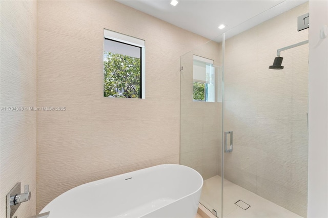 3132 Plaza St, Miami, FL 33133 - full bathroom with plenty of natural light, a shower stall, a soaking tub, and recessed lighting