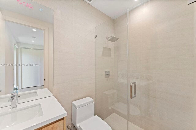 3132 Plaza St, Miami, FL 33133 - bathroom with toilet, a shower stall, double vanity, and recessed lighting