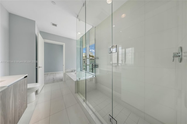 480 NE 31st St Unit 4307, Miami, FL 33137 - bathroom with toilet, a stall shower, tile patterned floors, a bath, and visible vents
