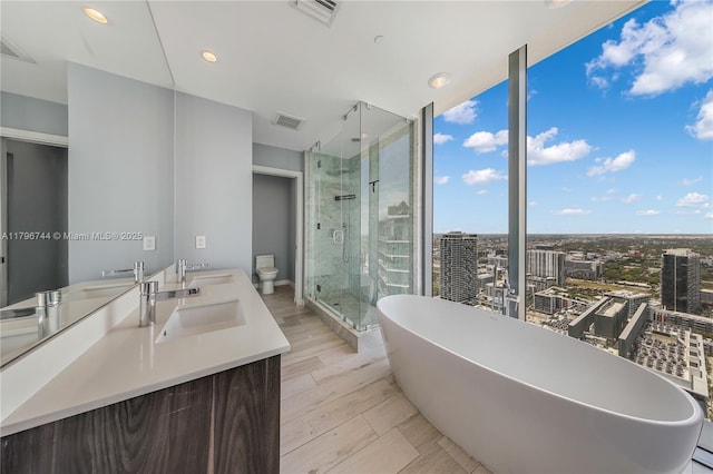 480 NE 31st St Unit 4307, Miami, FL 33137 - full bath with a sink, a shower stall, visible vents, and a freestanding tub