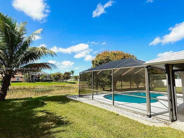 5400 NW Emblem St, Port St Lucie, FL 34983 - outdoor pool with a yard, glass enclosure, and a patio