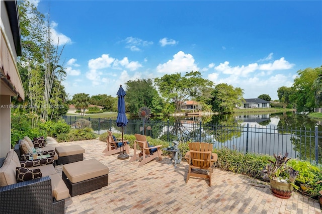 610 Lake Dasha Cir, Plantation, FL 33324 - fenced backyard featuring a patio area and a water view