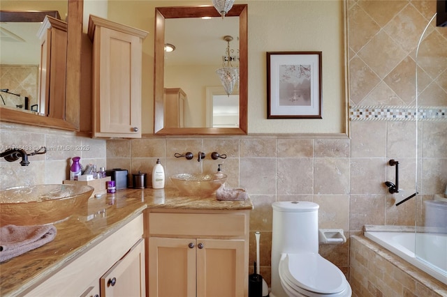 610 Lake Dasha Cir, Plantation, FL 33324 - bathroom with double vanity, tiled tub, and backsplash