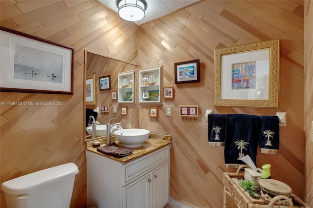 610 Lake Dasha Cir, Plantation, FL 33324 - bathroom featuring vanity and wooden walls