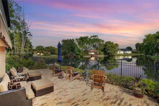 610 Lake Dasha Cir, Plantation, FL 33324 - fenced backyard with a patio, a water view, and an outdoor living space