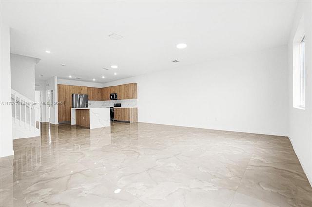 unfurnished living room featuring stairway, marble finish floor, and recessed lighting