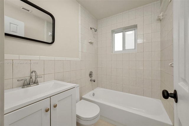 10051 SW 48th St, Miami, FL 33165 - full bathroom featuring toilet, shower / bath combination, tile walls, visible vents, and vanity