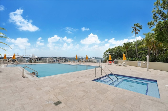 1581 Brickell Ave Unit Ph102, Miami, FL 33129 - community pool with a patio area and a community hot tub