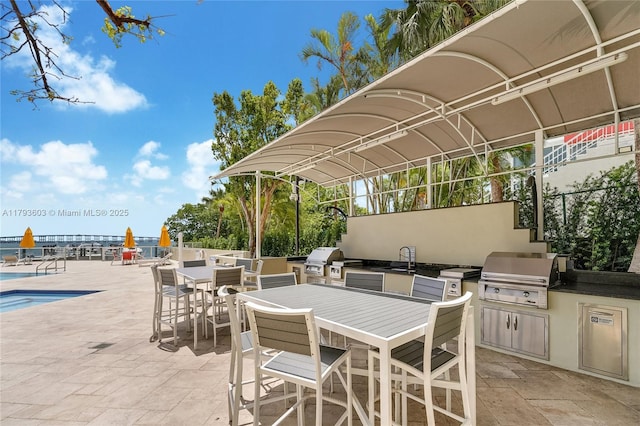 1581 Brickell Ave Unit Ph102, Miami, FL 33129 - view of patio / terrace with grilling area, area for grilling, outdoor dining space, and a sink