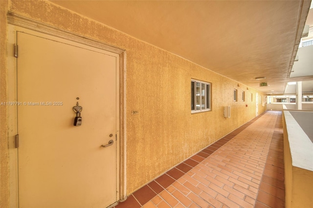 8888 Collins Ave Unit 201, Surfside, FL 33154 - corridor featuring brick floors