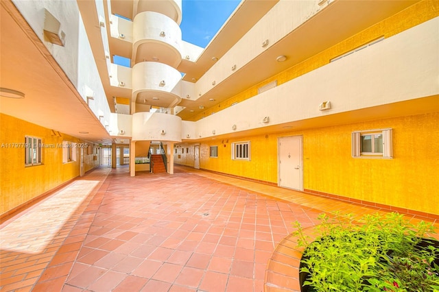 8888 Collins Ave Unit 201, Surfside, FL 33154 - building lobby with a high ceiling and wooden walls