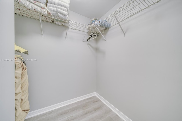 8888 Collins Ave Unit 201, Surfside, FL 33154 - spacious closet with wood finished floors