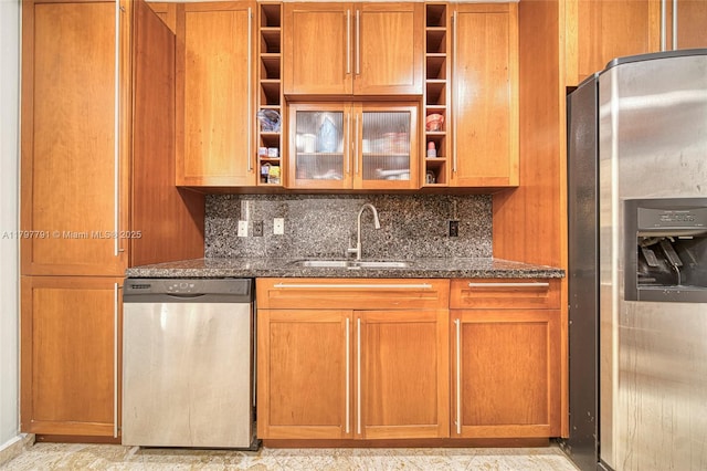 8888 Collins Ave Unit 201, Surfside, FL 33154 - kitchen featuring appliances with stainless steel finishes, open shelves, a sink, and dark stone counters