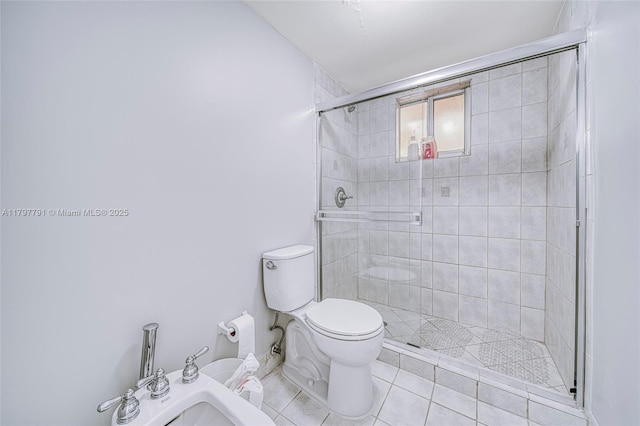 8888 Collins Ave Unit 201, Surfside, FL 33154 - bathroom featuring a shower stall, toilet, and tile patterned floors
