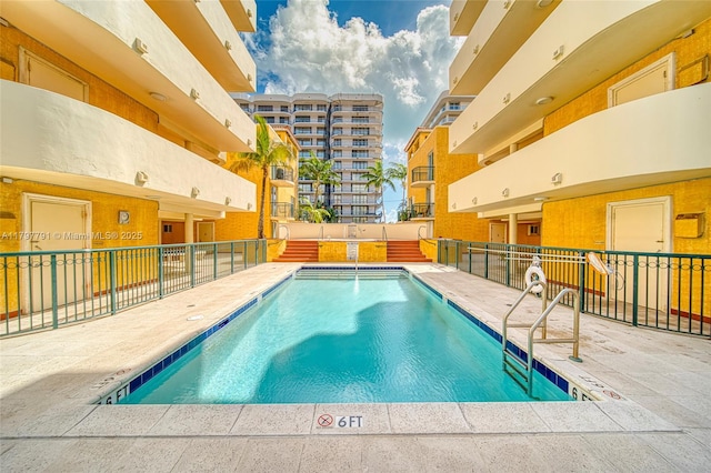 8888 Collins Ave Unit 201, Surfside, FL 33154 - community pool featuring fence and a patio