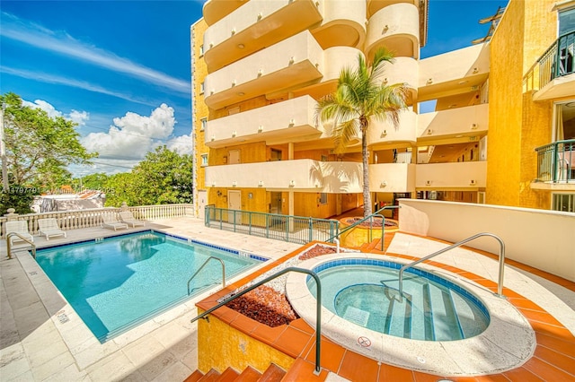 8888 Collins Ave Unit 201, Surfside, FL 33154 - community pool with a community hot tub and fence