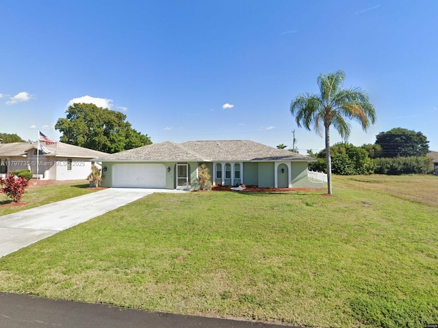 ranch-style home with an attached garage, concrete driveway, and a front lawn