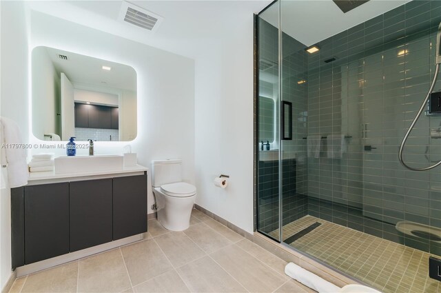 227 NE 2nd St Unit 2908, Miami, FL 33132 - bathroom with a stall shower, toilet, baseboards, visible vents, and tile patterned flooring