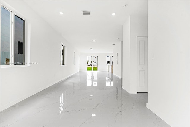 corridor featuring recessed lighting, baseboards, marble finish floor, and visible vents