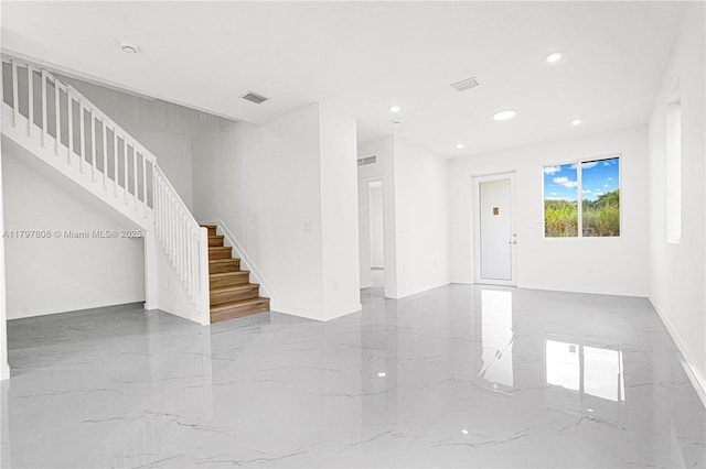 unfurnished living room featuring stairway, recessed lighting, marble finish floor, and visible vents