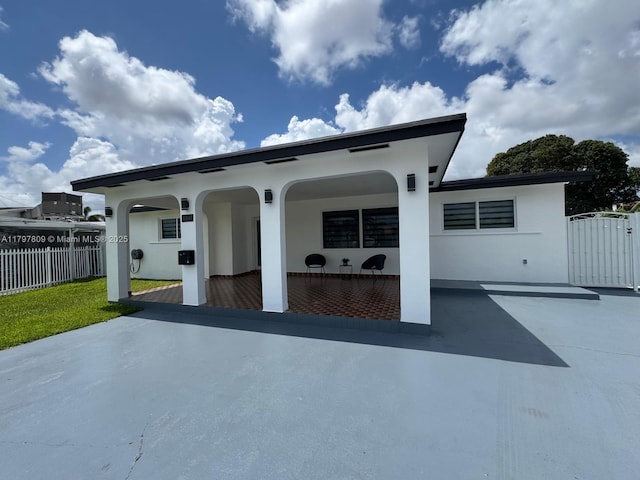 view of patio / terrace featuring fence