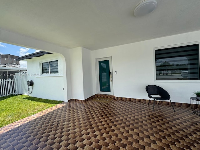 view of patio / terrace featuring fence