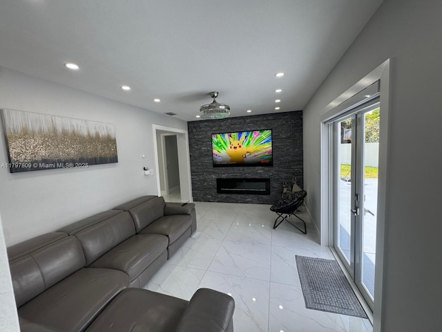 living room featuring a stone fireplace, recessed lighting, and marble finish floor
