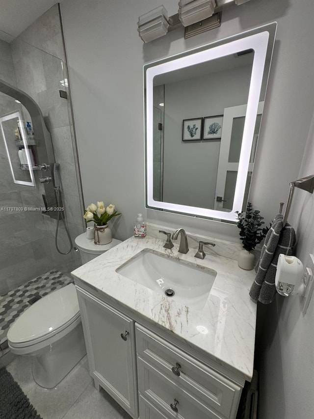 full bathroom with vanity, toilet, and a stall shower