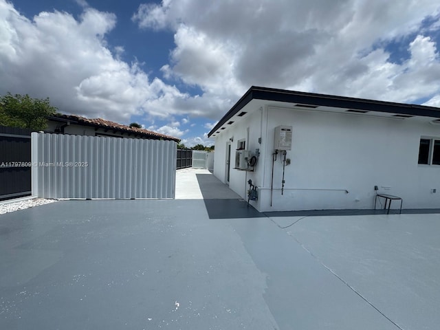 view of home's exterior with fence