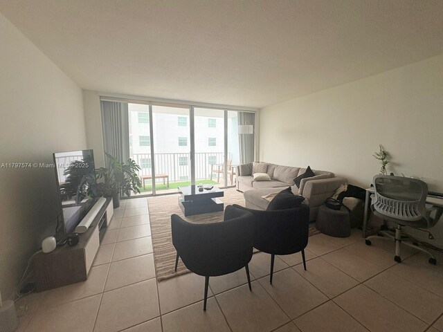 5838 Collins Ave Unit 10E, Miami Beach, FL 33140 - living room with floor to ceiling windows and light tile patterned floors