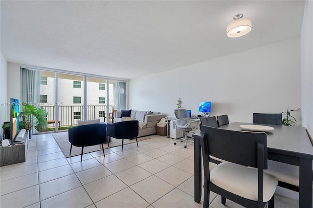 5838 Collins Ave Unit 10E, Miami Beach, FL 33140 - living room featuring light tile patterned floors and expansive windows