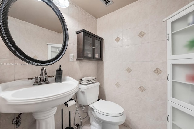 5838 Collins Ave Unit 10E, Miami Beach, FL 33140 - half bathroom featuring tile walls and backsplash
