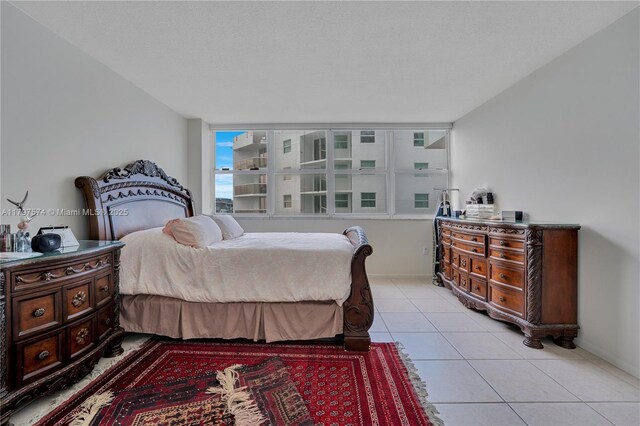 5838 Collins Ave Unit 10E, Miami Beach, FL 33140 - bedroom featuring light tile patterned floors