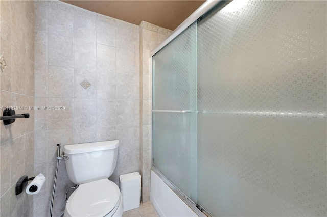 5838 Collins Ave Unit 10E, Miami Beach, FL 33140 - full bathroom featuring shower / bath combination with glass door and tile walls