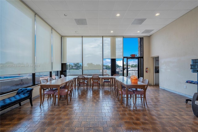 5838 Collins Ave Unit 10E, Miami Beach, FL 33140 - dining room featuring expansive windows and recessed lighting
