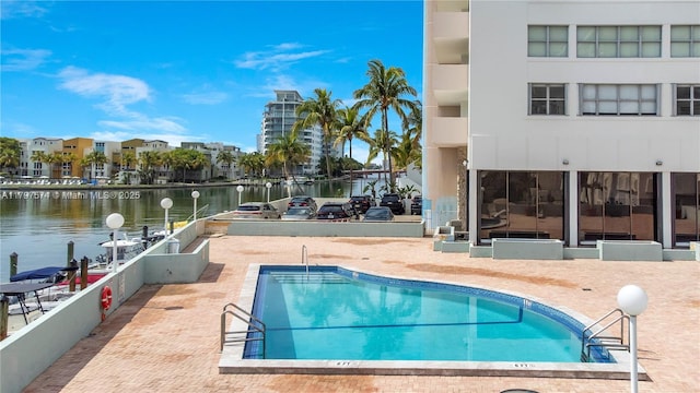 5838 Collins Ave Unit 10E, Miami Beach, FL 33140 - community pool featuring a water view and a patio