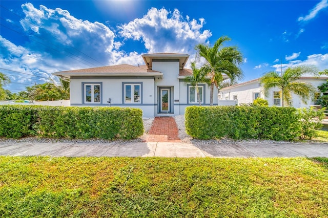 207 SW 11th St, Dania Beach, FL 33004 - view of front of property featuring stucco siding and a front lawn