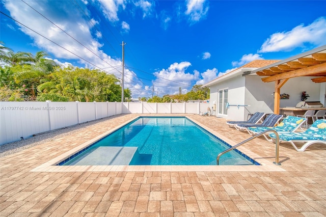 207 SW 11th St, Dania Beach, FL 33004 - view of swimming pool featuring a patio and a fenced backyard