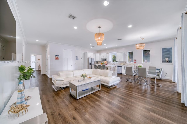 207 SW 11th St, Dania Beach, FL 33004 - living area featuring visible vents, baseboards, dark wood-style floors, ornamental molding, and recessed lighting