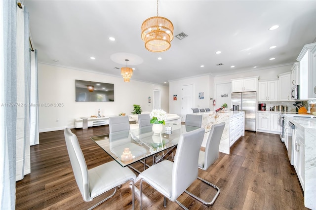 207 SW 11th St, Dania Beach, FL 33004 - dining space with crown molding, visible vents, dark wood-type flooring, and recessed lighting