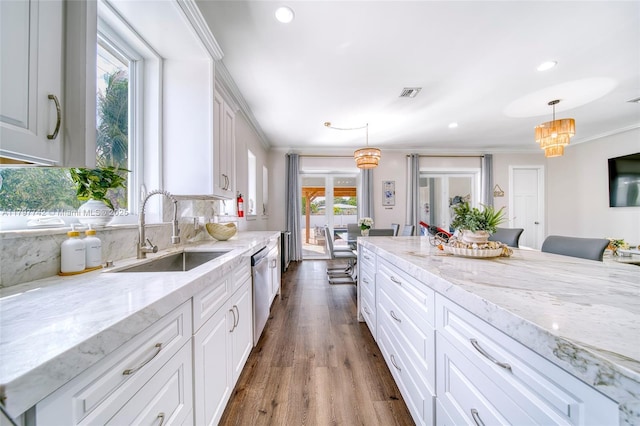 207 SW 11th St, Dania Beach, FL 33004 - kitchen featuring a sink, ornamental molding, healthy amount of natural light, dishwasher, and white cabinets
