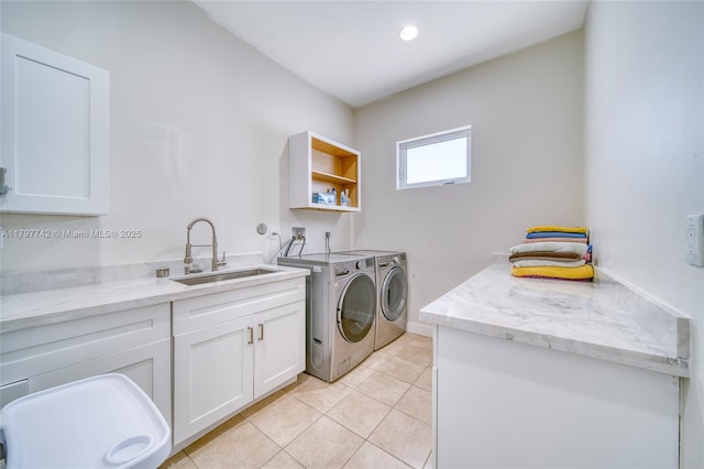 207 SW 11th St, Dania Beach, FL 33004 - laundry room with light tile patterned floors, a sink, cabinet space, baseboards, and independent washer and dryer