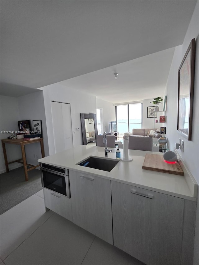 501 NE 31st St Unit 2802, Miami, FL 33137 - kitchen featuring open floor plan, light countertops, and modern cabinets
