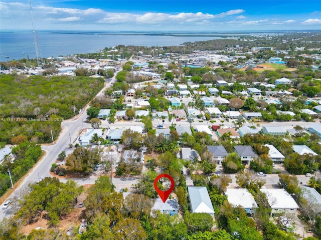 bird's eye view featuring a water view and a residential view
