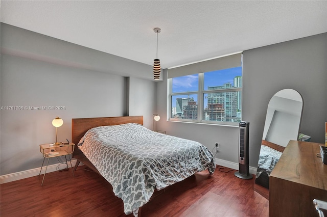 31 SE 5th St Unit 1505, Miami, FL 33131 - bedroom featuring baseboards, a view of city, and wood finished floors